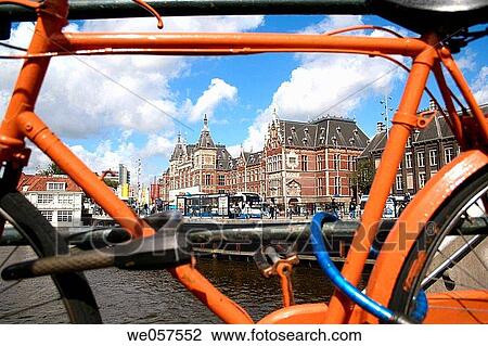 Orange bike parking at central station in Amsterdam, Holland, Netherlands View Large Photo Image Stock Image - Orange bike parking at central station in Amsterdam, Holland, Netherlands. Fotosearch