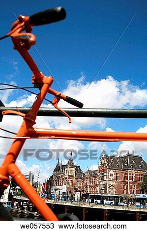 Orange bike parking at central station in Amsterdam, Holland, Netherlands View Large Photo Image Stock Image - Orange bike parking at central station in Amsterdam, Holland, Netherlands. Fotosearch