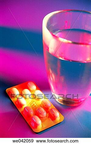 Pills and glass of water View Large Photo Image Stock Photo - Pills and glass of water. Fotosearch