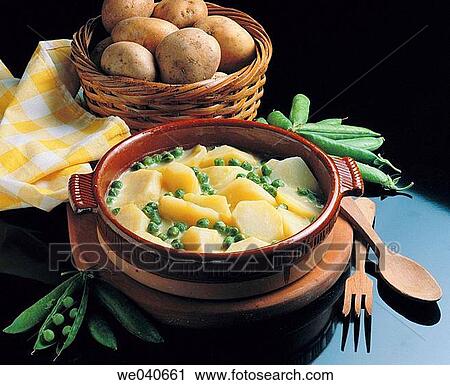 Potatoes with green sauce View Large Photo Image Stock Image - Potatoes with green sauce. Fotosearch