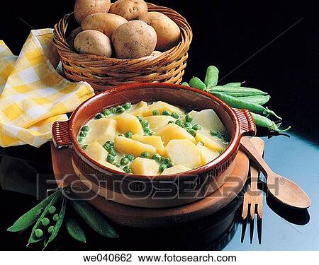 Potatoes with green sauce View Large Photo Image Stock Image - Potatoes with green sauce. Fotosearch