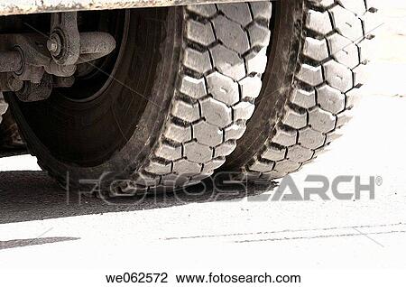 Rear wheels of heavy trucks View Large Photo Image Stock Image - Rear wheels of heavy trucks. Fotosearch