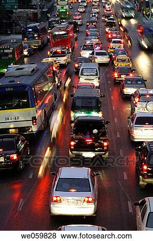 Stock Photo - Rush hour with traffic jam at the early evening on Rajadamri Road at the World Trade Centre of Bangkok, Thailand, Southeast Asia. Fotosearch
