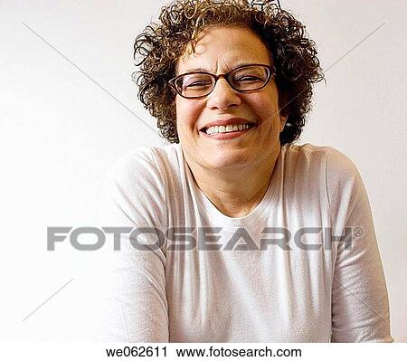 Sixty-four-year old woman smiling View Large Photo Image Stock Image - Sixty-four-year old woman smiling. Fotosearch