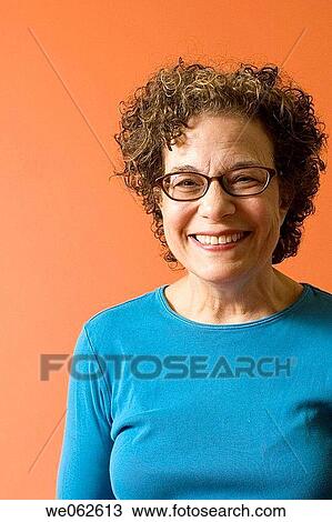 Sixty-four-year old woman smiling View Large Photo Image Stock Image - Sixty-four-year old woman smiling. Fotosearch