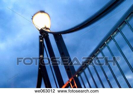 Streetlight, on a bridge, against a deep blue sky. View Large Photo Image Stock Image - Streetlight, on a bridge, against a deep blue sky.. Fotosearch
