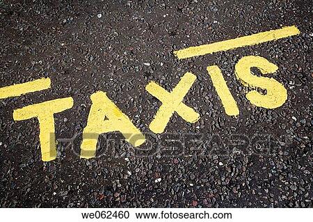 Taxis sign on road, London. England, UK View Large Photo Image Stock Image - Taxis sign on road, London. England, UK. Fotosearch