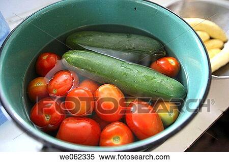 Tomato and cucumber in pot of water View Large Photo Image Stock Photography - Tomato and cucumber in pot of water. Fotosearch