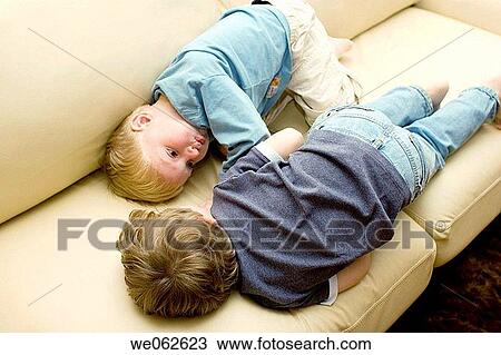Two four-year-old boys lying down and talking View Large Photo Image Stock Image - Two four-year-old boys lying down and talking. Fotosearch