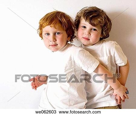 Two three-year-old boys hugging View Large Photo Image Stock Image - Two three-year-old boys hugging. Fotosearch