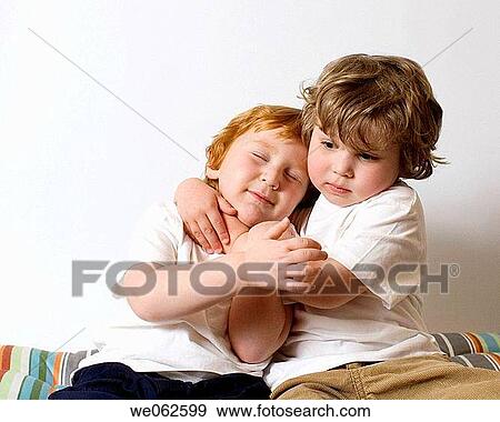 Two three-year-old boys hugging View Large Photo Image Stock Photo - Two three-year-old boys hugging. Fotosearch