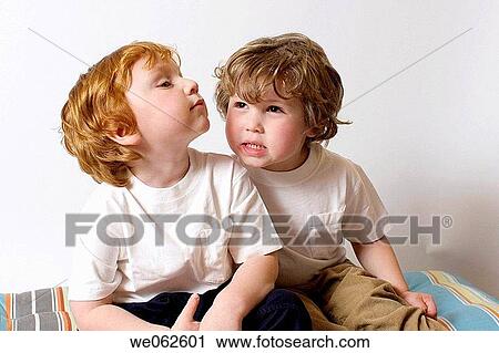 Stock Image - Two three-year-old boys playing. Fotosearch