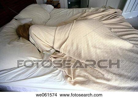 Picture - Woman asleep in bed. Fotosearch