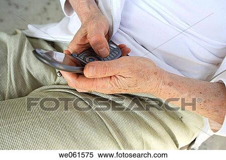 Woman sending text message on cellular phone View Large Photo Image Stock Photography - Woman sending text message on cellular phone. Fotosearch