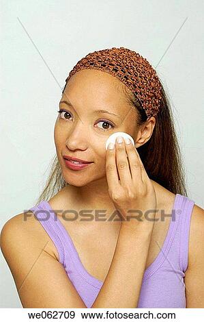 Woman with cotton pad View Large Photo Image Stock Photo - Woman with cotton pad. Fotosearch