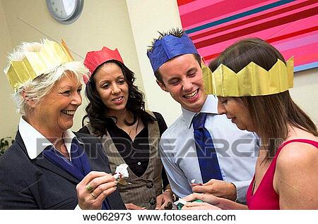 Work colleagues at their office Christmas party. View Large Photo Image Stock Image - Work colleagues at their office Christmas party.. Fotosearch