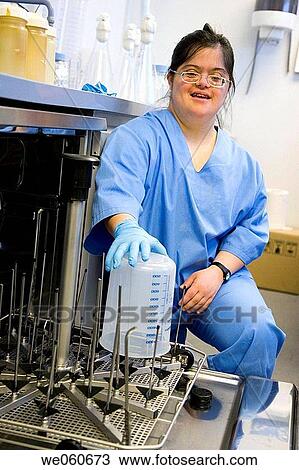 Worker with down's syndrome, sterilization area, biopharmaceutical lab, Grupo Genetrix, Madrid View Large Photo Image Stock Image - Worker with down's syndrome, sterilization area, biopharmaceutical lab, Grupo Genetrix, Madrid. Fotosearch