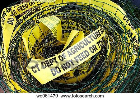 Yellow? DO NOT FEED OR TOUCH? signs attached to a coiled metal fence. View Large Photo Image Stock Photo - Yellow? DO NOT FEED OR TOUCH? signs attached to a coiled metal fence.. Fotosearch