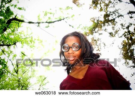 Young black woman, wearing funny glasses, posing View Large Photo Image Stock Photo - Young black woman, wearing funny glasses, posing. Fotosearch