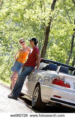Young couple on the road. Gipuzkoa, Euskadi. View Large Photo Image Stock Photo - Young couple on the road. Gipuzkoa, Euskadi.. Fotosearch