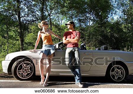 Stock Photograph - Young couple on the road. Gipuzkoa, Euskadi.. Fotosearch
