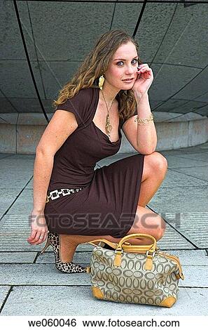 Young female fashion model posing in urban environment. View Large Photo Image Stock Photograph - Young female fashion model posing in urban environment.. Fotosearch