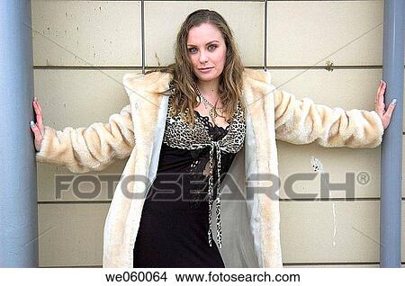 Young female fashion model wearing a fur coat. View Large Photo Image Picture - Young female fashion model wearing a fur coat.. Fotosearch