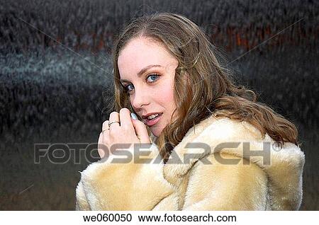 Young female fashion model wearing a fur coat. View Large Photo Image Stock Image - Young female fashion model wearing a fur coat.. Fotosearch