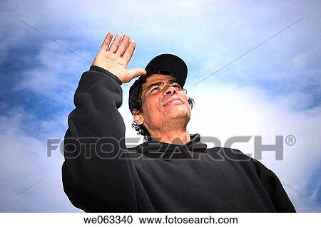 Young Hispanic man, wearing a hat, posing. View Large Photo Image Stock Image - Young Hispanic man, wearing a hat, posing.. Fotosearch