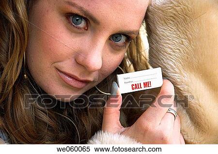 Young woman in fur coat posing with box of matches printed with contact details. View Large Photo Image Stock Photography - Young woman in fur coat posing with box of matches printed with contact details.. Fotosearch