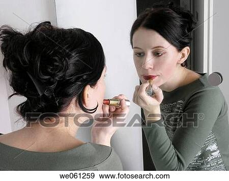 Young woman in mirror, make-up View Large Photo Image Stock Photo - Young woman in mirror, make-up. Fotosearch