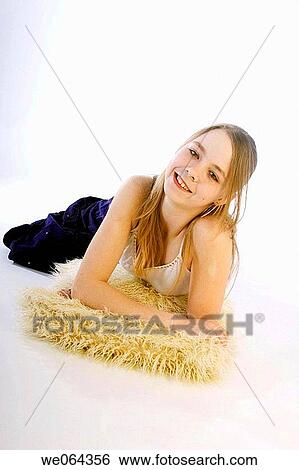 13 year old girl lying on the floor in the studio View Large Photo Image Stock Photograph - 13 year old girl lying on the floor in the studio. Fotosearch