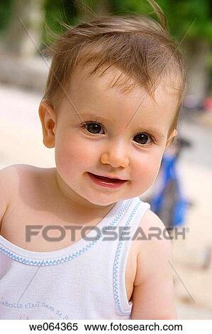 Stock Photography - 14 month old baby girl, smiling into camera. Fotosearch