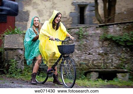 16-17 year old girls riding bike View Large Photo Image Stock Image - 16-17 year old girls riding bike. Fotosearch