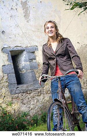 17 year old girl on bike View Large Photo Image Stock Photograph - 17 year old girl on bike. Fotosearch