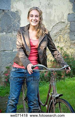 17 year old girl with bike View Large Photo Image Stock Photo - 17 year old girl with bike. Fotosearch