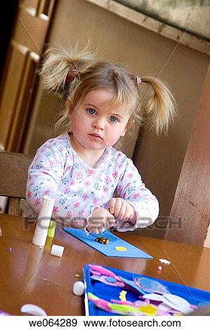 2 year old girl, sitting doing some craftwork View Large Photo Image Stock Photo - 2 year old girl, sitting doing some craftwork. Fotosearch