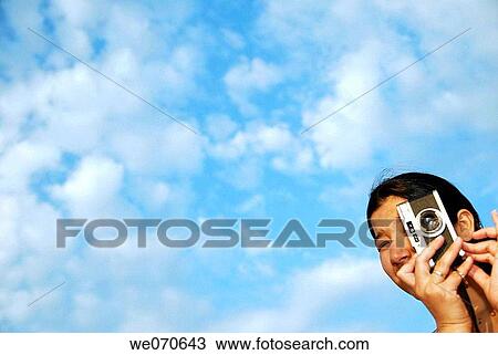 23 year old woman holding camera. View Large Photo Image Stock Image - 23 year old woman holding camera.. Fotosearch