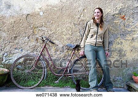 25-30 year old woman with bike View Large Photo Image Stock Photo - 25-30 year old woman with bike. Fotosearch