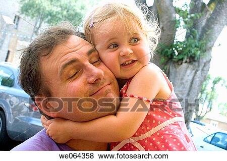 3 year old daughter hugging her daddy tightly round his neck View Large Photo Image Stock Photo - 3 year old daughter hugging her daddy tightly round his neck. Fotosearch