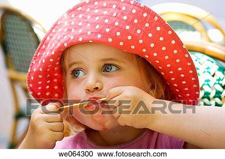 3 year old girl eating a lolly, sucking the stick, headshot View Large Photo Image Stock Image - 3 year old girl eating a lolly, sucking the stick, headshot. Fotosearch