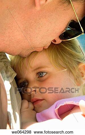 3 year old girl, having a cuddle with her father, he's kissing her head View Large Photo Image Stock Photo - 3 year old girl, having a cuddle with her father, he's kissing her head. Fotosearch