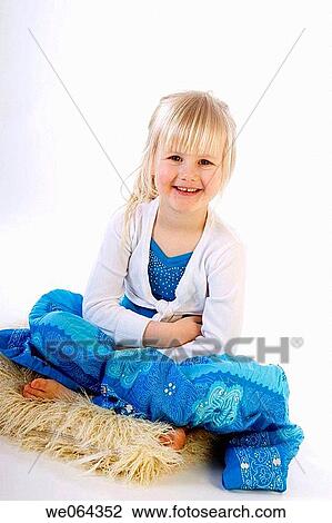 3 year old girl sitting crosslegged on the studio floor, smiling into camera View Large Photo Image Stock Image - 3 year old girl sitting crosslegged on the studio floor, smiling into camera. Fotosearch