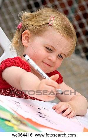 3 year old girl sitting in a cafe drawing, concentrating on her picture View Large Photo Image Stock Photograph - 3 year old girl sitting in a cafe drawing, concentrating on her picture. Fotosearch
