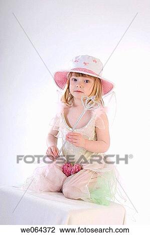 3 year old girl sitting on a box in the studio, looking into camera, serious View Large Photo Image Stock Image - 3 year old girl sitting on a box in the studio, looking into camera, serious. Fotosearch