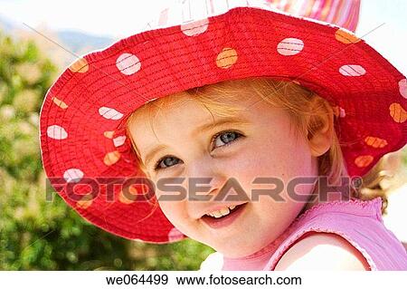 3 year old girl, smiling off camera, wearing a huge sunhat View Large Photo Image Stock Photo - 3 year old girl, smiling off camera, wearing a huge sunhat. Fotosearch