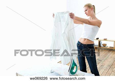 Stock Photograph - 30's, blond, at-home, appliance, 20's. Fotosearch