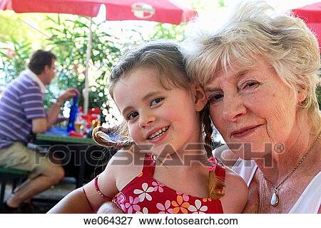 5 year old girl sitting with her grandmother on holiday View Large Photo Image Stock Photo - 5 year old girl sitting with her grandmother on holiday. Fotosearch