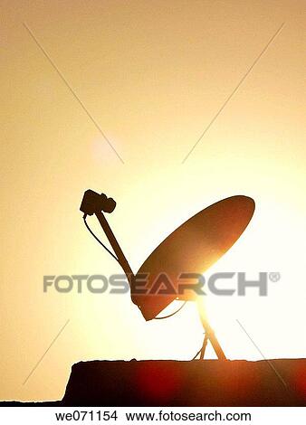 A dish antenna of a television set on a building terrace. Pune, Maharashtra, India. View Large Photo Image Picture - A dish antenna of a television set on a building terrace. Pune, Maharashtra, India.. Fotosearch