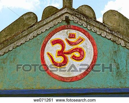A holy sign called om is painted on front side of a Hindu temple roof. Maharashtra, India. View Large Photo Image Stock Image - A holy sign called om is painted on front side of a Hindu temple roof. Maharashtra, India.. Fotosearch